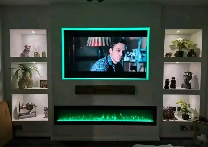 Jamie’s bespoke media wall with TV recess, shelving and illuminated feature fire