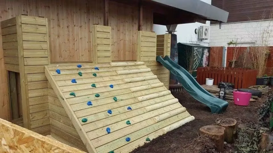 Jamie’s hand-built timber nursery play structure with climbing ramp and slide